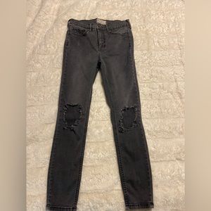 Free People Black jeans with rip in knees. Size 27